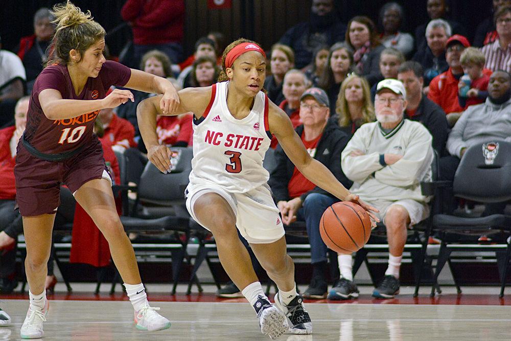 Sophomore guard Kai Crutchfield drives to the basket against Virginia Tech guard Kendyl Brooks on Sunday, Jan. 20 at Reynolds Coliseum. Crutchfield grabbed nine rebounds in the Wolfpack&#8217;s 70-61 overtime win.