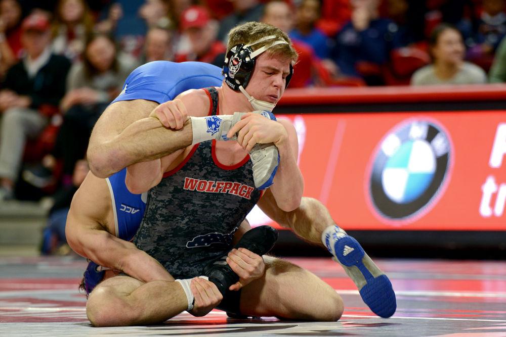 *Editor's note: the original photo has been replaced.
Redshirt sophomore Daniel Bullard, No. 21 in the 174 weight class, tries to take down Duke sophomore Matt Finesilver, No. 16 in the 174 weight class, on Friday, Jan. 25 in Reynolds Coliseum. Finesilver eventually defeated Bullard 8-7, but the No. 8 Wolfpack beat Duke 30-12.