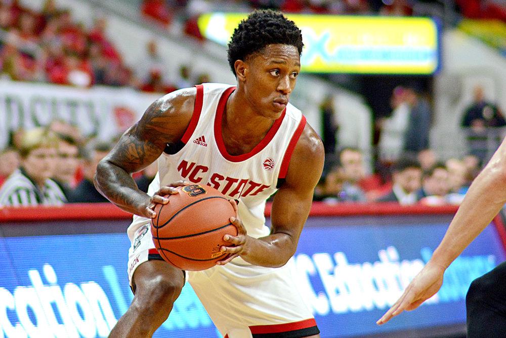 Redshirt junior guard C.J. Bryce looks to pass against Mercer on Saturday, Nov. 24, 2018 at PNC Arena. Bryce recorded 17 points on 7-12 shooting along with four rebounds as the Wolfpack won 78-74.