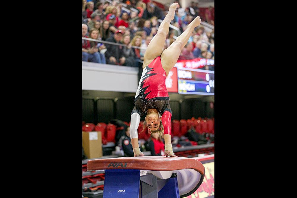 Sophomore Drew Grantham hits the vault. Grantham had a team-high 9.875 during the meet on Saturday, Feb. 17, 2018 in Reynolds Coliseum.