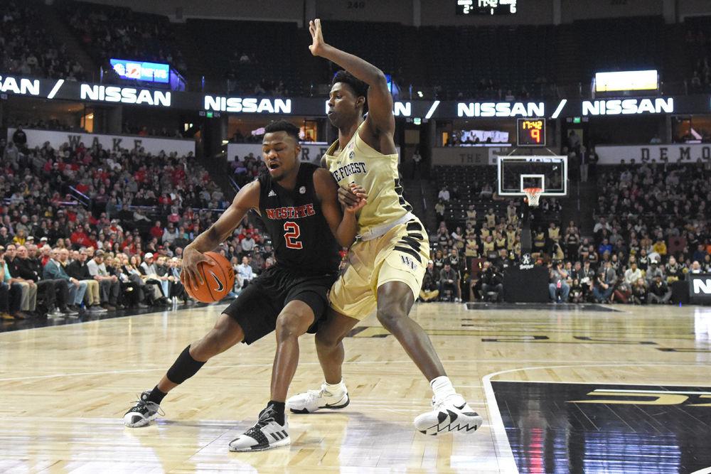 Redshirt senior guard Torin Dorn tries to get past Wake Forest on Tuesday, Jan. 15 in Lawrence Joel Veterans Memorial Coliseum. Despite Dorn scoring 18 points, the Wolfpack still lost to the Demon Deacons 71-67.