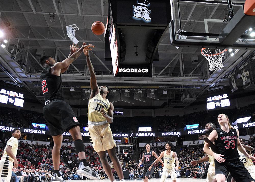 Redshirt senior guard Torin Dorn shoots the ball during the game against Wake Forest on Tuesday, Jan. 15 in Lawrence Joel Veterans Memorial Coliseum. Despite Dorn scoring 18 points, the Wolfpack still lost to the Demon Deacons 71-67.