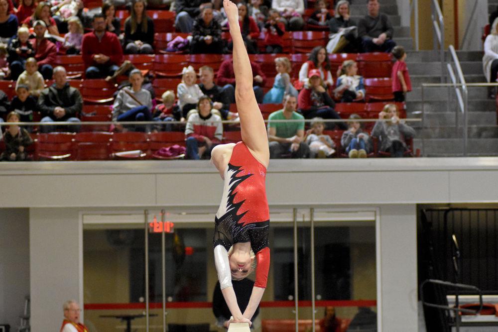 Sophomore Nicole Webb, from Morrisville, North Carolina, performs in exhibition on the beam during the meet against Ohio State on Saturday, Jan. 12, 2019 in Reynolds Coliseum. The Wolfpack, despite losing to the Buckeyes 196.025-194.925, set a new season high score for the team.