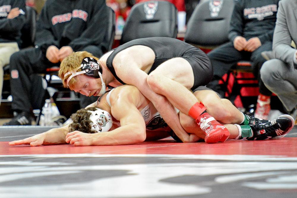 Graduate Justin Oliver, ranked No. 4 in the 149-pound weight class, wrestles Brown freshman Samuel Lynch on Saturday, Jan. 12 at PNC Arena. Oliver won his bout 19-4, contributing to the Wolfpack's 29-10 win over Brown.