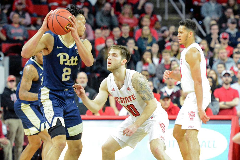 Sophomore guard Braxton Beverly defends Pittsburgh guard Trey McGowens on Saturday, Jan. 12 at PNC Arena. Beverly scored 9 points as NC State won 86-80.
