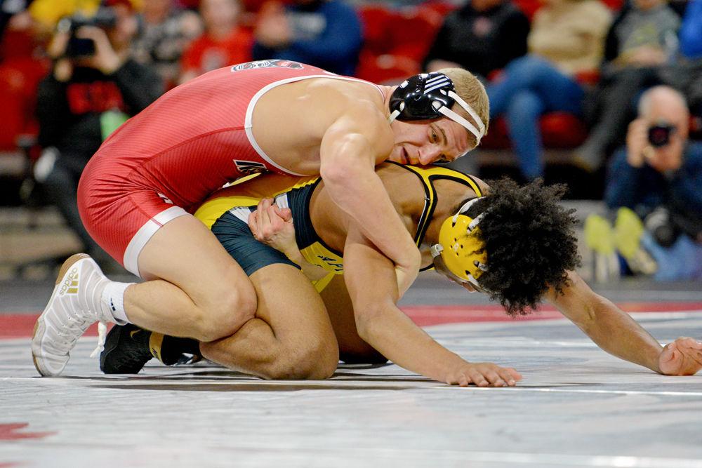 NC State's Hayden Hidlay takes down Appalachian State's Angel Najar at Reynolds Coliseum on Dec. 4, 2018. The Wolfpack won 29-9.