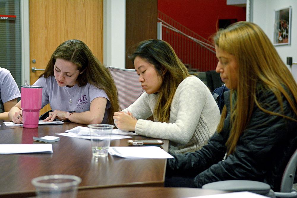 Maggie Ross, a freshman studying biomedical engineering, Jasmine Wang, a junior studying computer science and Isabelle Babson, a senior studying psychology, write comments in response to the amendments proposed to the Title IX law on Wednesday, Jan. 30, 2019 at Talley Student Union. Submitted comments are addressed by the U.S. Department of Education.