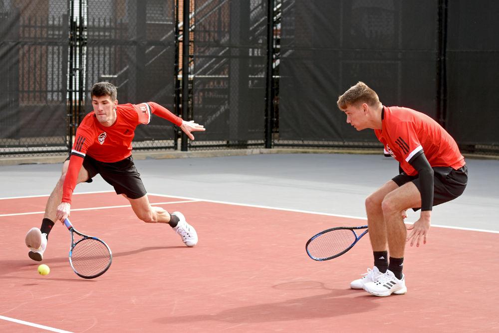 Senior Ivan Saveljic races to save the ball alongside sophomore Collin Shick during their doubles match against South Carolina at the J.W. Isenhour Tennis Center on Saturday, Feb. 9. The team lost their match to South Carolina with an overall score of 6-1 and later won their second match of the day against North Carolina A&amp;T with an overall score of 7-0.