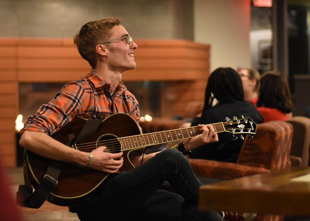 Timothy Boushell socializes with other students before UAB's Chords and Coffee event in the One Earth Lounge on Wednesday, Feb. 6. Chords and Coffee invites anyone to perform and includes free coffee and tea.