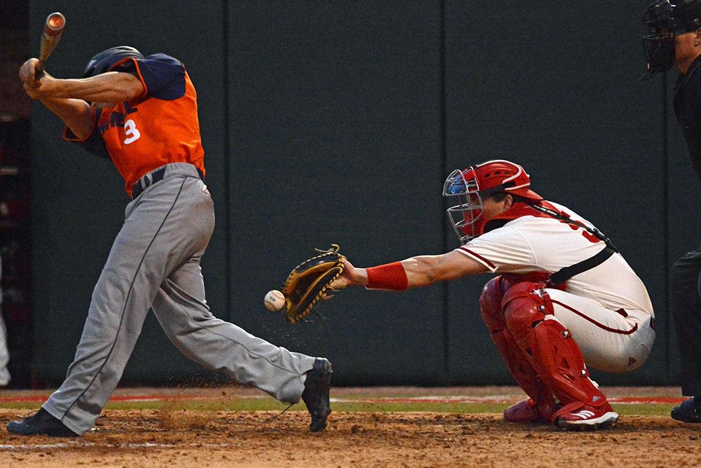 Sophomore catcher Patrick Bailey reaches out to catch a pitch against Bucknell on Feb. 15 at Doak Field. Bailey went 1-5 with two strikeouts, one run batted in and one run scored in the Wolfpack&#8217;s 8-2 win.