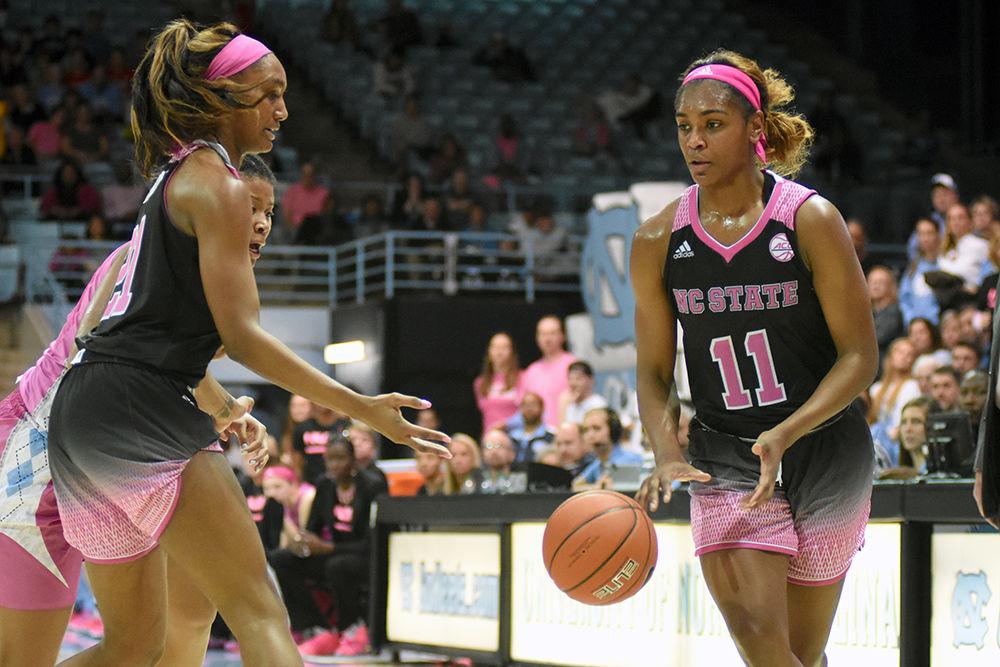 Graduate guard Kiara Leslie receives the ball from senior forward DD Rogers during the game against UNC-Chapel Hill on Sunday, Feb. 24, 2019 in Carmichael Arena. The Wolfpack beat the Tarheels 74-69.