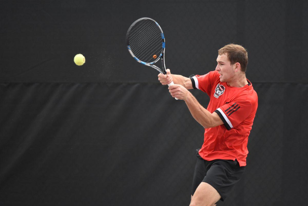 Yannai Barkai, a freshman playing third seed in singles against South Carolina, returns a ball to his opponent in the J.W. Isenhour Tennis Center on Saturday, Feb. 9. Barkai earned the Wolfpack's only point during their game against the Gamecocks, resulting in an overall score of 6-1. Later that day, the NC State men's tennis team won against the North Carolina A&amp;T Aggies 7-0.