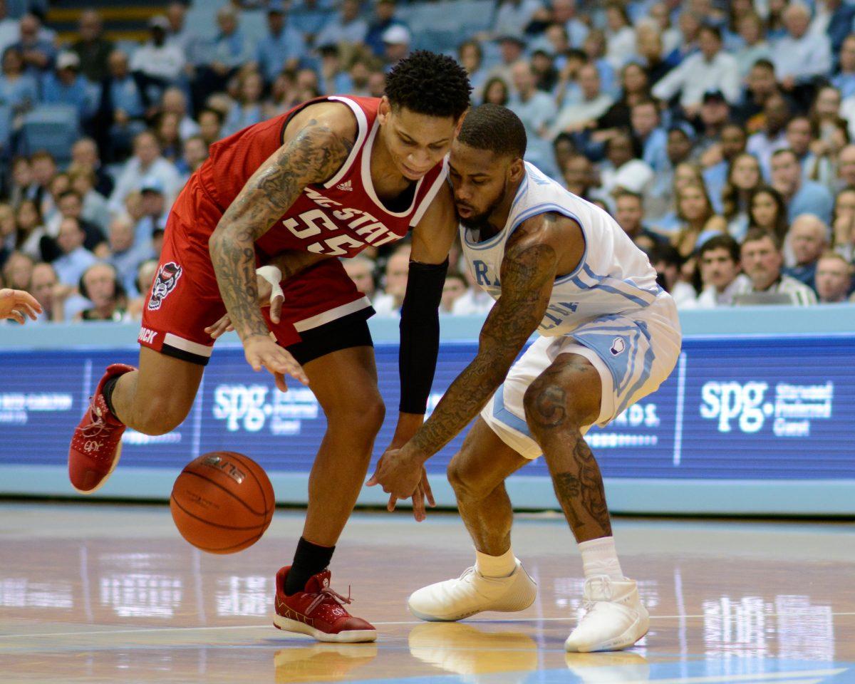 Sophomore guard Blake Harris fights for the ball against UNC-Chapel Hill on Tuesday, Feb. 5 in the Dean E. Smith Center. The Wolfpack lost to the Tar Heels 113-96.