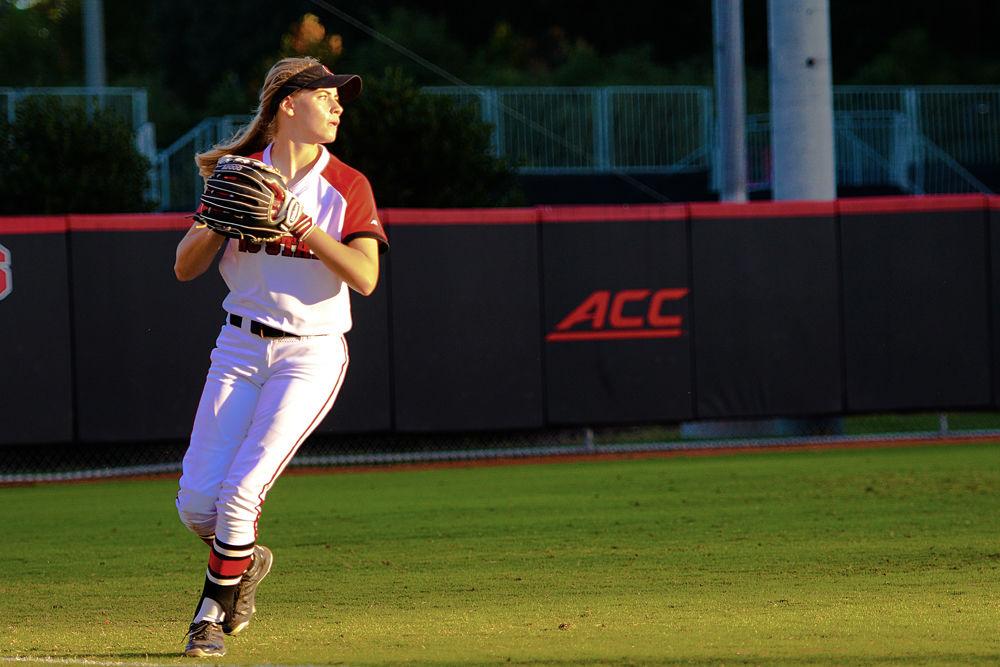 Freshman outfielder Sam Russ looks to throw to the infield against East Carolina on Oct. 6, 2017 in Dail Softball Stadium. The Wolfpack won the first game of that day&#8217;s doubleheader 8-1.