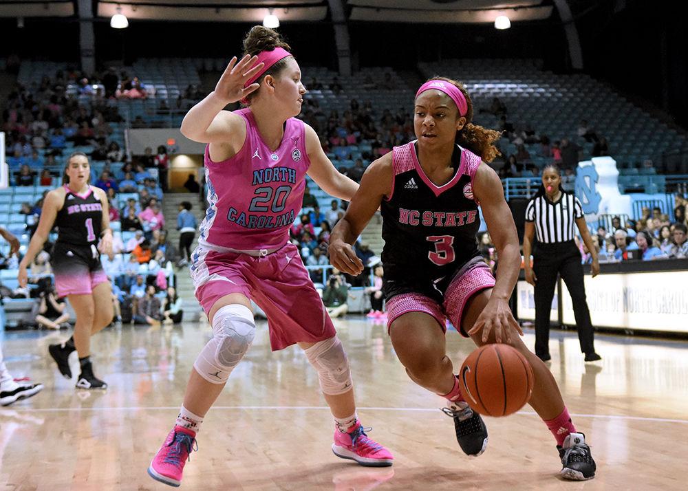 Sophomore guard Kai Crutchfield dribbles around a UNC-Chapel Hill player during the game on Sunday, Feb. 24, 2019 in Carmichael Arena. The Wolfpack beat the Tarheels 74-69.