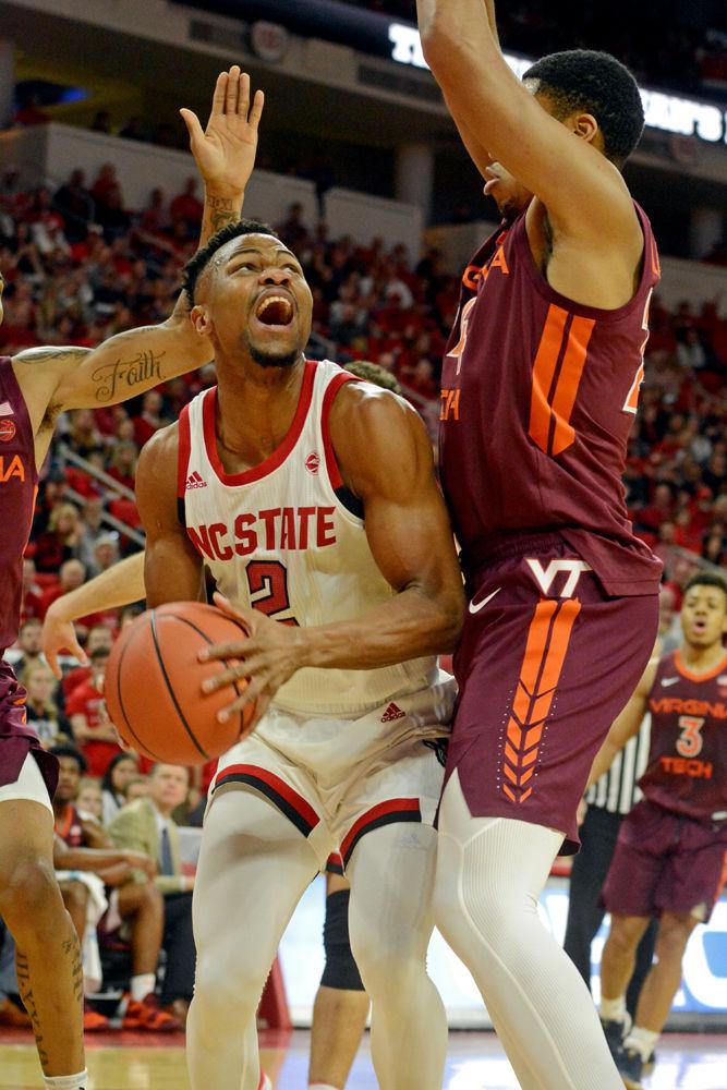 Redshirt senior guard Torin Dorn prepares to shoot against Virginia Tech on Saturday, Feb. 2 at PNC Arena. The Wolfpack lost 47-24.