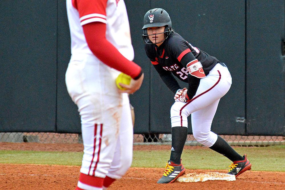 Junior utility player Brigette Nordberg stands at first base on Sunday, Feb. 17, 2019 at Dail Softball Stadium. Nordberg had one home run, two runs batted in and one run scored. The Wolfpack lost to Wisconsin 6-3.