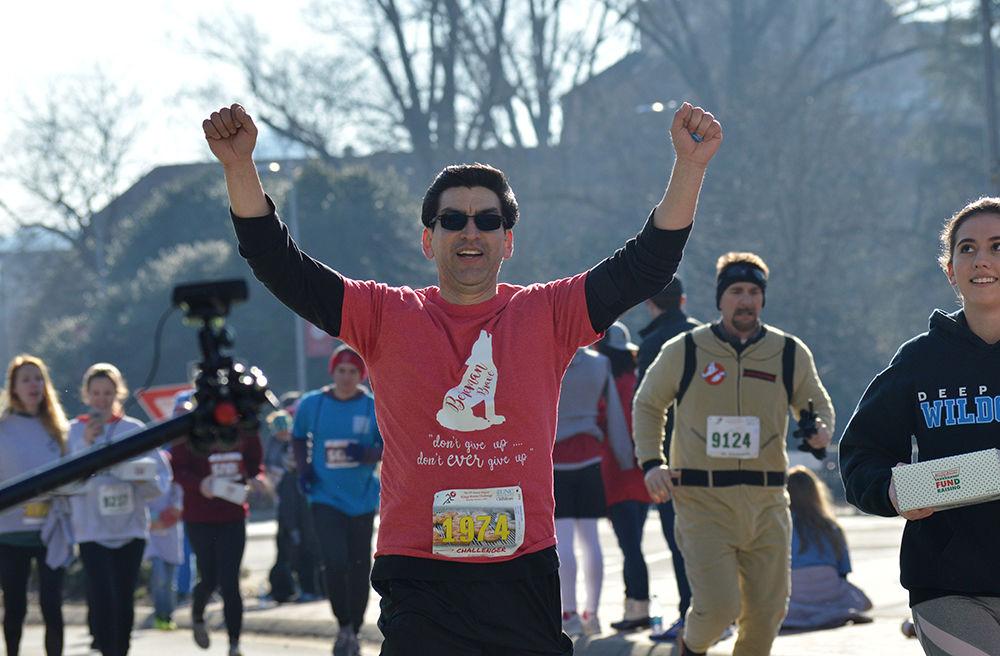 Sam Rodriguez, a challenger from Virginia, completes the final stretch of the Krispy Kreme Challenge Saturday Feb. 2. on Hillsborough St. This year, the Krispy Kreme Challenge had its 15th annual race.