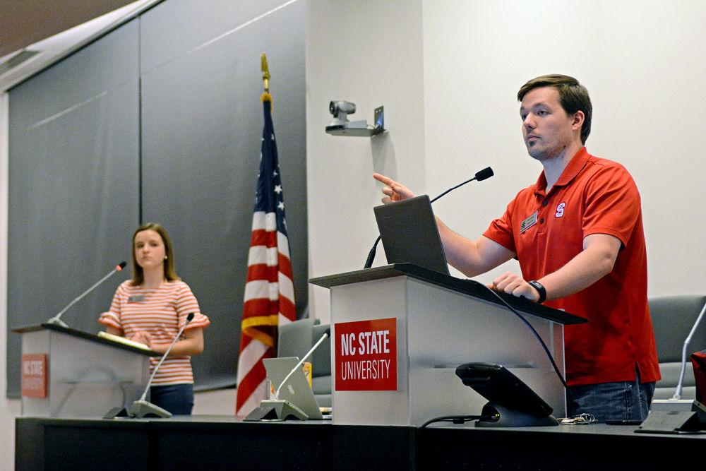 Chris Poteat, a Ph.D. student in chemistry, and Student Body Treasurer and Chair of the Senate Finance Committee Molly Mueller, a fourth-year studying political science, discuss the Student Government budget at Talley Student Union on Wednesday, Feb. 27, 2019.