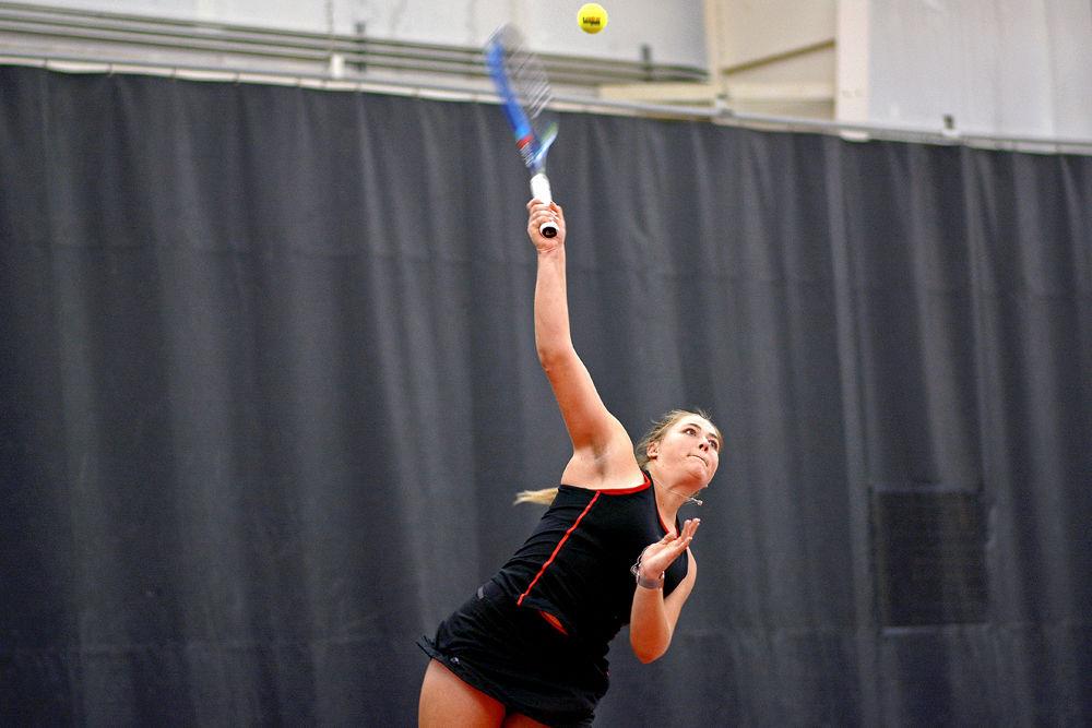 Sophomore Liz Norman serves against James Madison University freshman Daniela Voloh on Saturday, Feb. 16, 2019 at J.W. Isenhour Tennis Center. Norman defeated Voloh 6-2, 6-3.