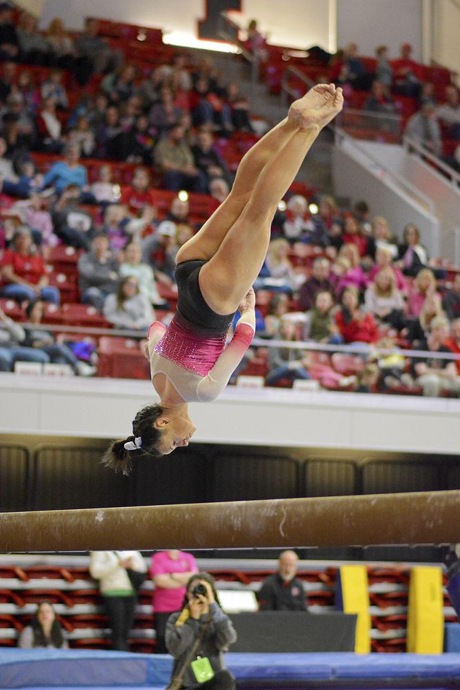 Senior Caitlyn Fillard performs on the balance beam against Pittsburgh on Saturday, Feb. 9 at Reynolds Coliseum. Fillard placed second on the beam and first all around. The Wolfpack defeated the Panthers 196.400 to 194.825.