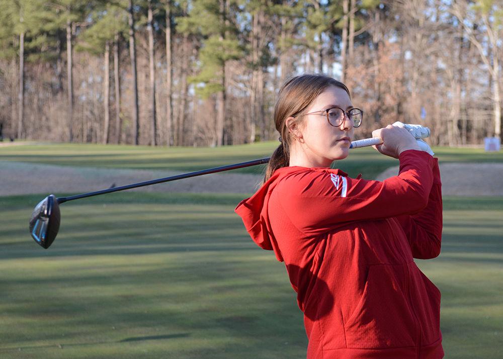 Laura Kowohl, a senior golfer at NC State swings her driver at the University Club on January 31, 2019. Kowohl led the team in the 2017-2018 season with a 73.87 stroke average and six top 20 finishes.
