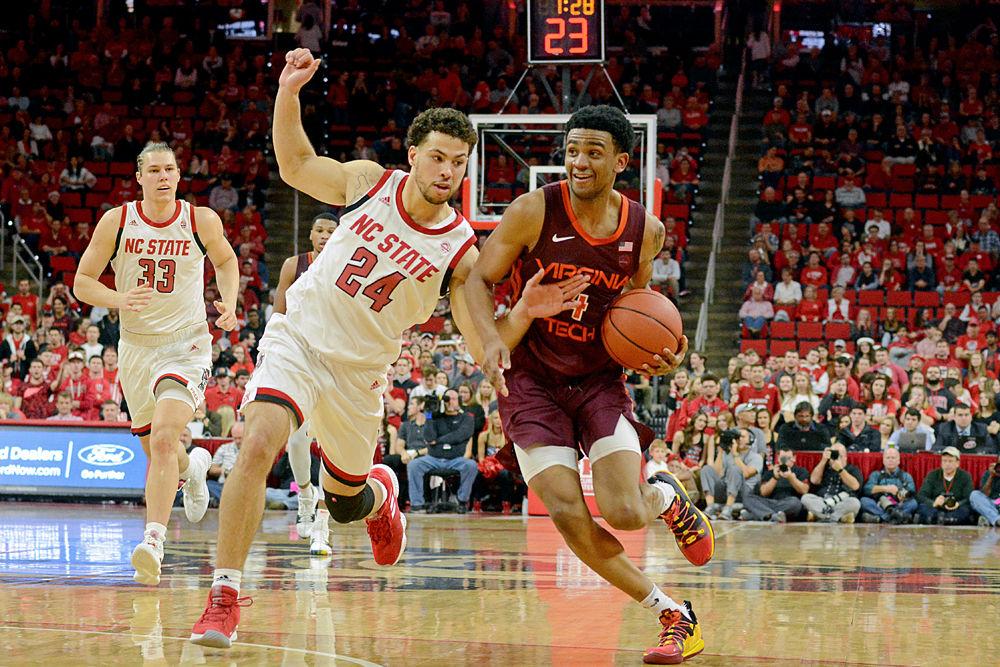 Redshirt sophomore Devin Daniels defends Virginia Tech guard Nickeil Alexander-Walker&#160;on Saturday, Feb. 2 at PNC Arena. The Wolfpack lost 47-24.