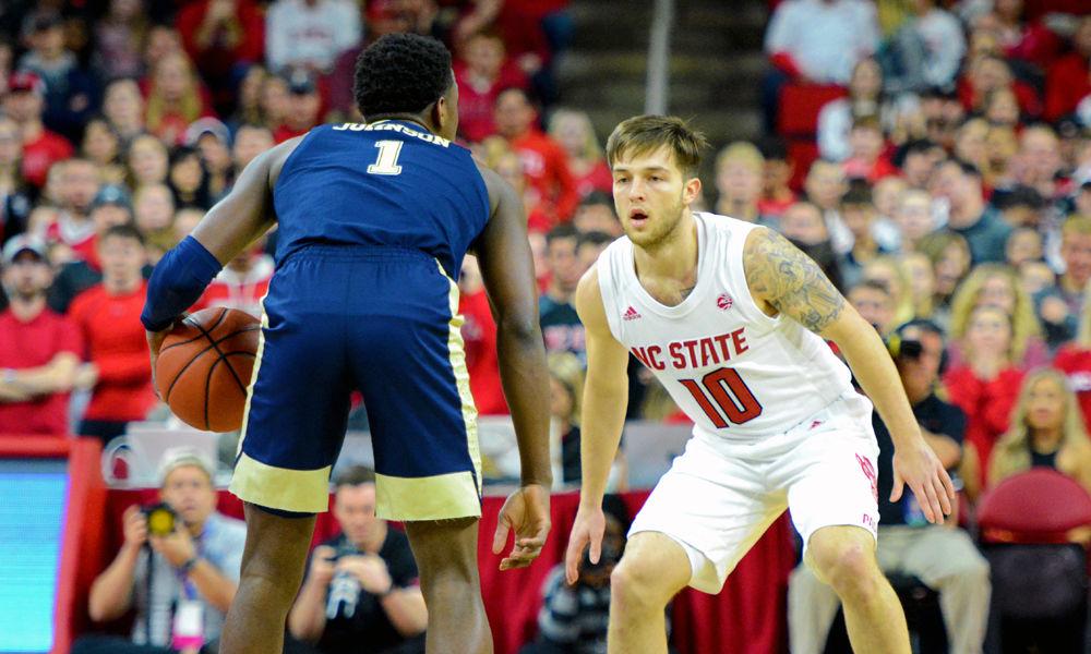 Sophomore guard Braxton Beverly defends Pittsburgh guard Xavier Johnson on Saturday, Jan. 12 at PNC Arena. Beverly scored 9 points as NC State won 86-80.