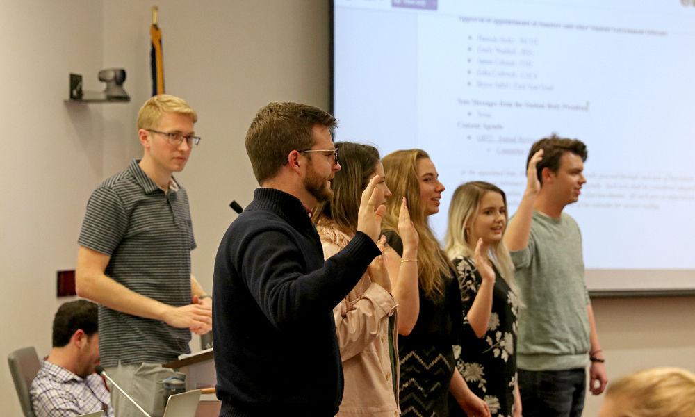 Student Senate President Adam Schmidt walks newly appointed senators through the oath of office in Talley Student Union on Wednesday, Feb. 6, 2019. Student Senate meetings are held on a biweekly basis in room 4140.