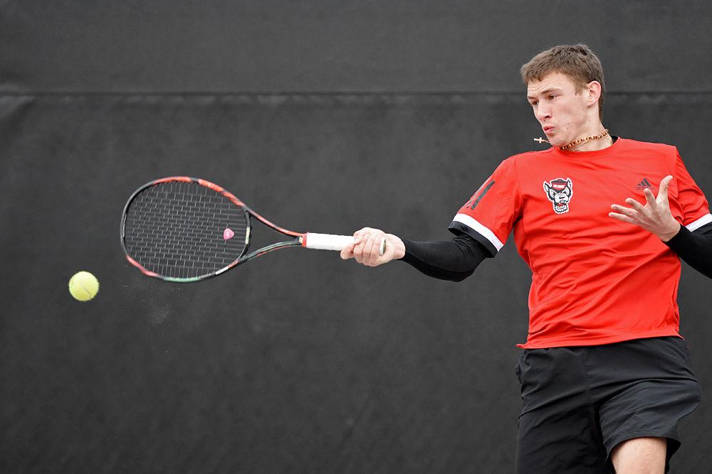 Sophomore Tadas Babelis, playing second seed in singles against South Carolina, returns the ball at the J.W. Isenhour Tennis Center on Saturday, Feb. 9. The men's tennis team lost their match against the Gamecocks 6-1, returning later in the day to beat the North Carolina A&amp;T Aggies 7-0.