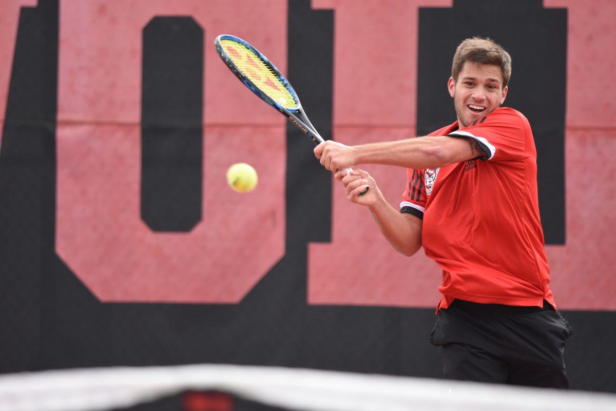 Junior Alexis Galarneau, playing first seed in singles, returns a ball during a match against South Carolina at the J.W. Isenhour Tennis Center on Saturday, Feb. 9. The Wolfpack lost 6-1 to the Gamecocks and won 7-0 against the North Carolina A&amp;T Aggies later that day.