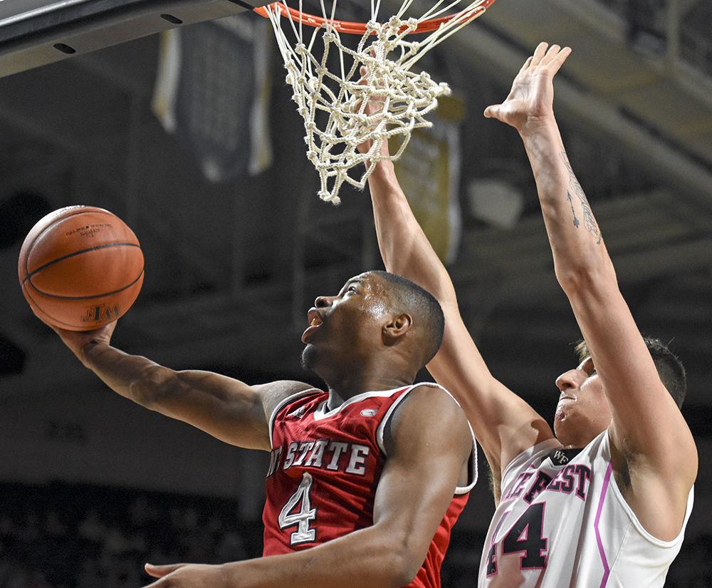 Freshman guard Dennis Smith Jr. goes underneath for a basket in the Wolfpack's 88-58 loss to Wake Forest on Feb. 11, 2017.&#160; Smith made 7 of 13 shots from the field and had 17 total points in the loss at Lawrence Joel Veterans Memorial Coliseum.