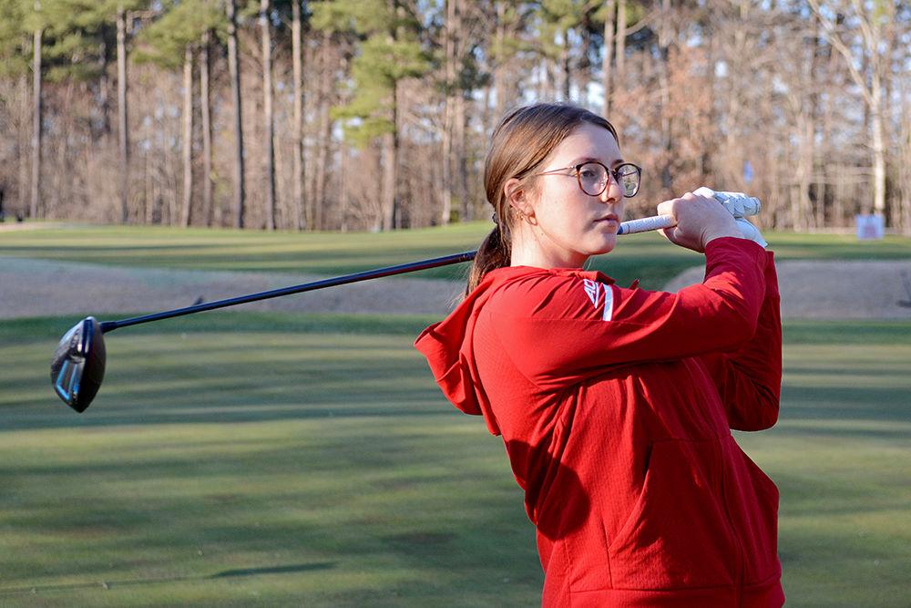 Senior Laura Kowohl swings her driver at the University Club on Thursday, Jan. 31, 2019. Kowohl led the team in the 2017-2018 season with a 73.87 stroke average and six top-20 finishes.