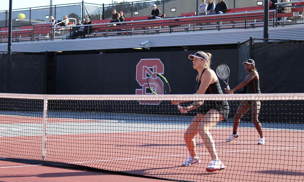 Junior Anna Rogers and freshman Alana Smith compete in a doubles match against Texas Tech at J.W. Isenhour Tennis Complex on Friday, Feb. 1. Rogers and Smith won their match 6-2.
