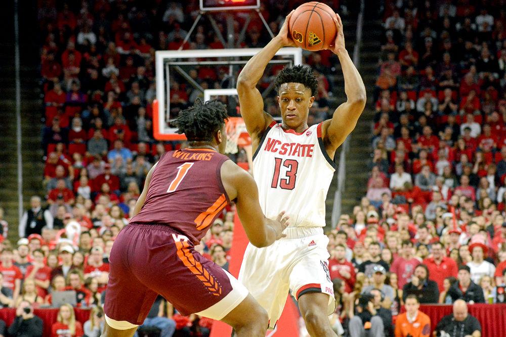 Redshirt junior C.J. Bryce tries to get past Virginia Tech guard Isaiah Wilkins on Saturday, Feb. 2 at PNC Arena. The Wolfpack lost 47-24.