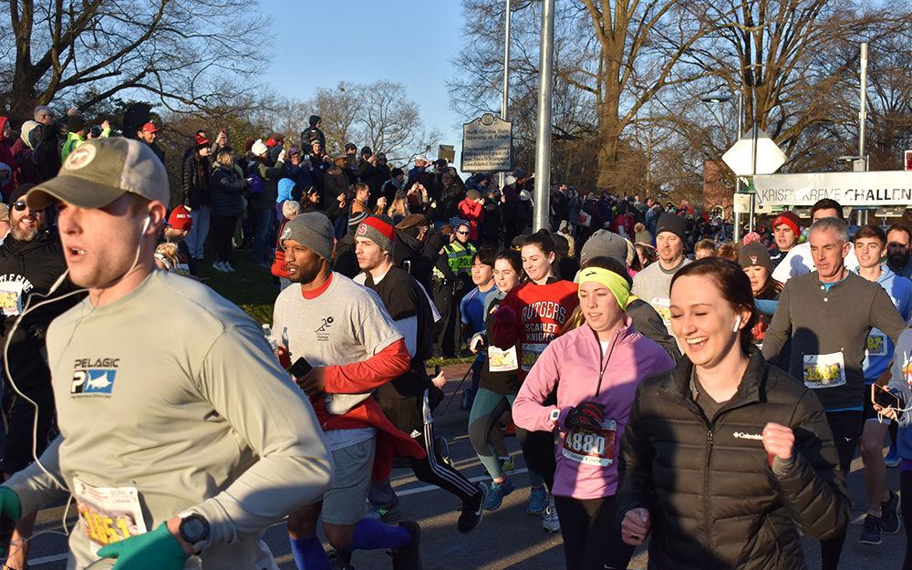 Participants of the Krispy Kreme Challenge start their race on Hillsborough Street at the Memorial Belltower, Saturday, Feb. 2. This year marks the 15th year that the race has taken place. All proceeds go to benefit the UNC Children's Hospital.