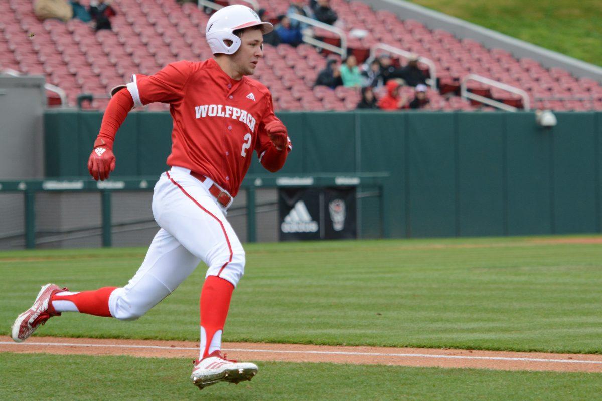 Sophomore outfielder Jonny Butler runs to first base during the game versus Bucknell on Saturday, Feb. 16, 2019 at Doak Field. The Wolfpack beat the Bison 14-2.