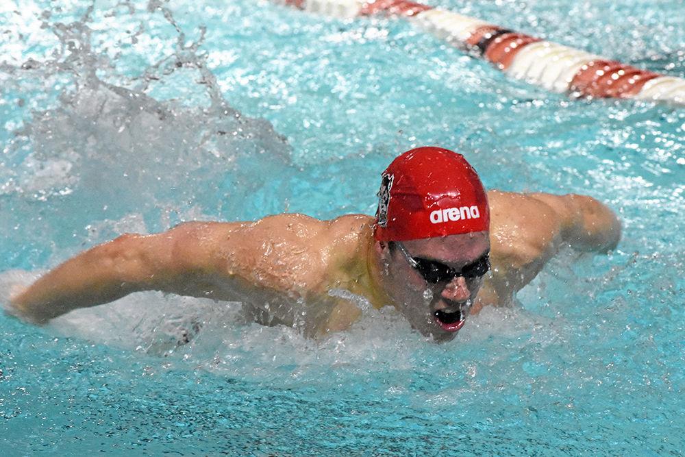 Noah Hensley, a freshman from Oviedo, Florida, swims in the men 100 yard butterfly during the meet against UNC-Chapel Hill on Saturday, Jan. 19, 2018 in the Willis R. Casey Aquatic Center. The Wolfpack men's swimming and diving team beat the Tarheels 197-97.