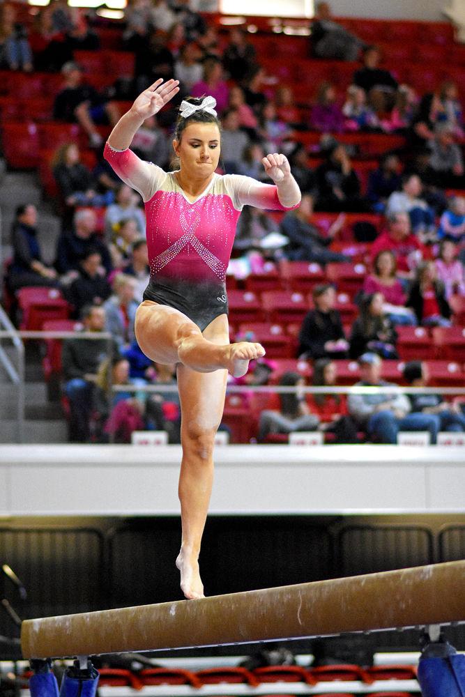 Senior Caitlyn Fillard performs on the balance beam against Pittsburgh at Reynolds Coliseum on Saturday, Feb. 9, 2019. The Wolfpack beat Pittsburgh 196.400 - 194.825 bringing their win record to 5-2. Webb scored 9.825 on the beam and the high all-around score in the match of 39.200.