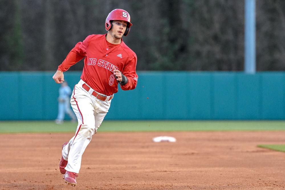 Sophomore infielder Will Wilson runs to third base against Georgia Tech on Friday, March 23, 2018 at Doak Field. Although losing 13-4 to the Yellow Jackets in the first game of that day&#8217;s doubleheader, the Wolfpack came back to win the second matchup 5-2.