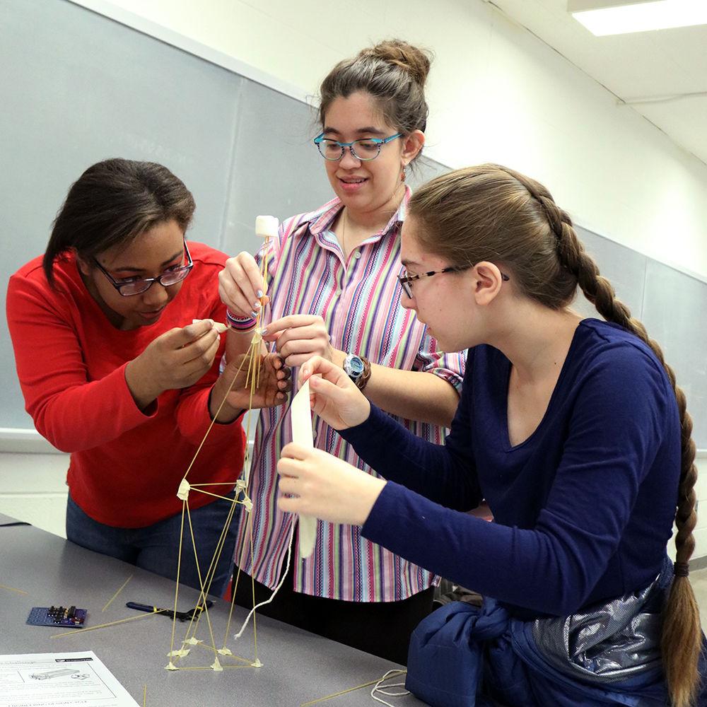 Third year at Apex Friendship High School Tiffany Trotter, third year at Chapel Hill High School Rosemary Maloney and second year at East Chapel Hill High School Kate Scheer build a marshmallow tower to learn more about civil engineering at the Girls Engineering Change event on Saturday, Feb. 16 at Mann Hall. The program, held annually, is three weeks long and lets NC State students mentor high school students from the Triangle area.