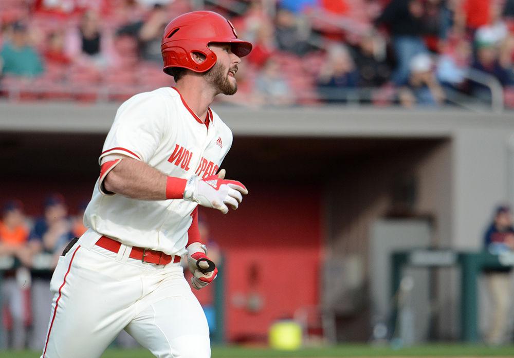 Senior infielder Evan Edwards watches his home run fly toward the outfield wall on Friday, Feb. 15 at Doak Field. Edwards went 3-4 with one home run, one triple, one double and three runs scored as the Wolfpack beat Bucknell 8-2.