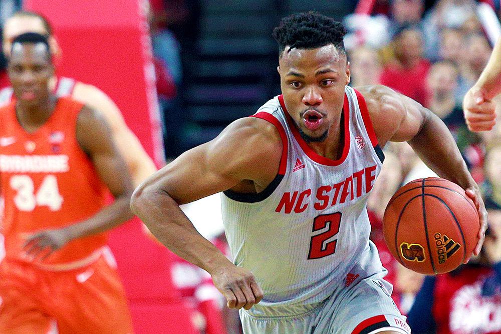 Redshirt senior guard Torin Dorn dribbles down the court looking for a shot in transition. Dorn had a double-double with 16 points and 12 rebounds during the 73-58 victory over Syracuse on Wednesday, Feb. 13, 2019 in PNC Arena.