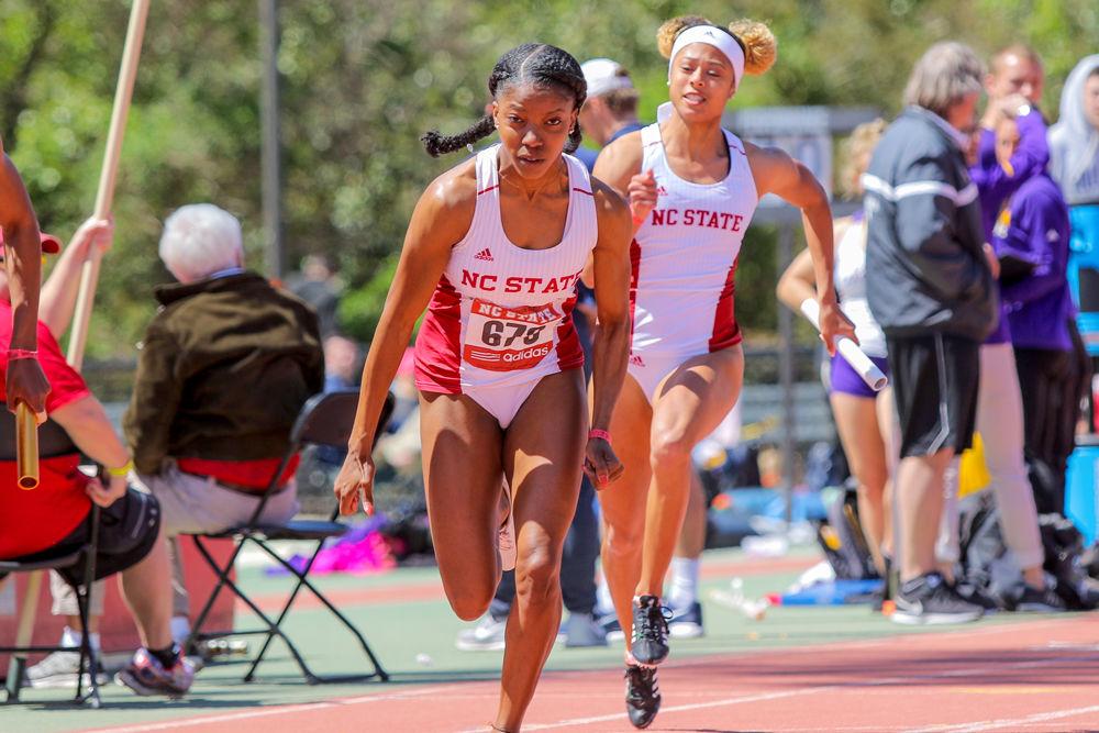 Junior Gabriele Cunningham passes the baton to redshirt senior Tiana Patillo for the third leg of the Women's 4x100m on Saturday, March 31, 2018. NC State took second place with 45.41, the third best time in school history in the Raleigh Relays at the Paul Derr Track and Field Facility.