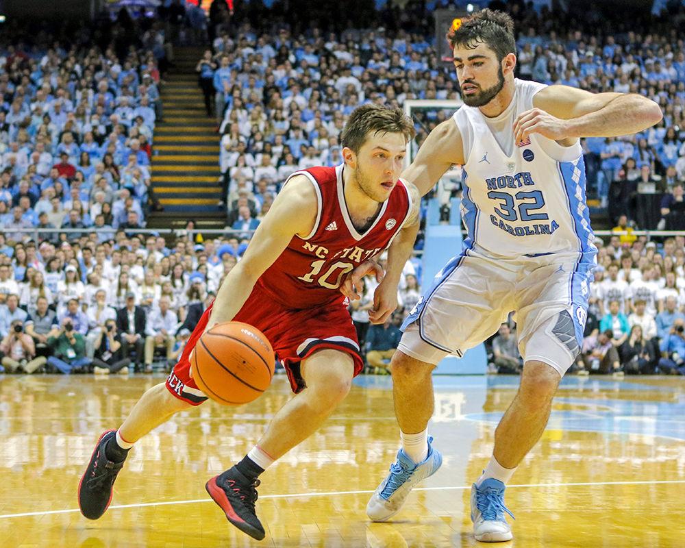 Freshman guard Braxton Beverly breaks to the inside against UNC-Chapel Hill forward Luke Maye during the 95-91 overtime win in the Dean E. Smith Center on Saturday, Jan. 27, 2018.