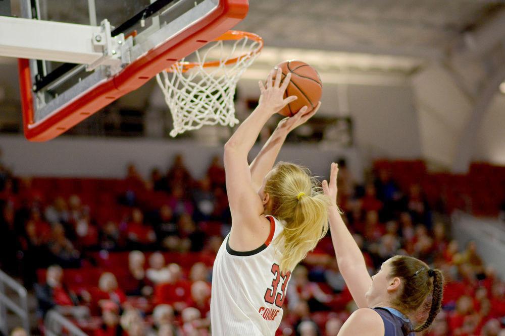 Freshman center Elissa Cunane attacks the basket against Maine on Saturday, Dec. 15 at Reynolds Coliseum. Cunane scored 11 points on 4-4 shooting along with eight rebounds and four turnovers in the Wolfpack&#8217;s 84-46 win.