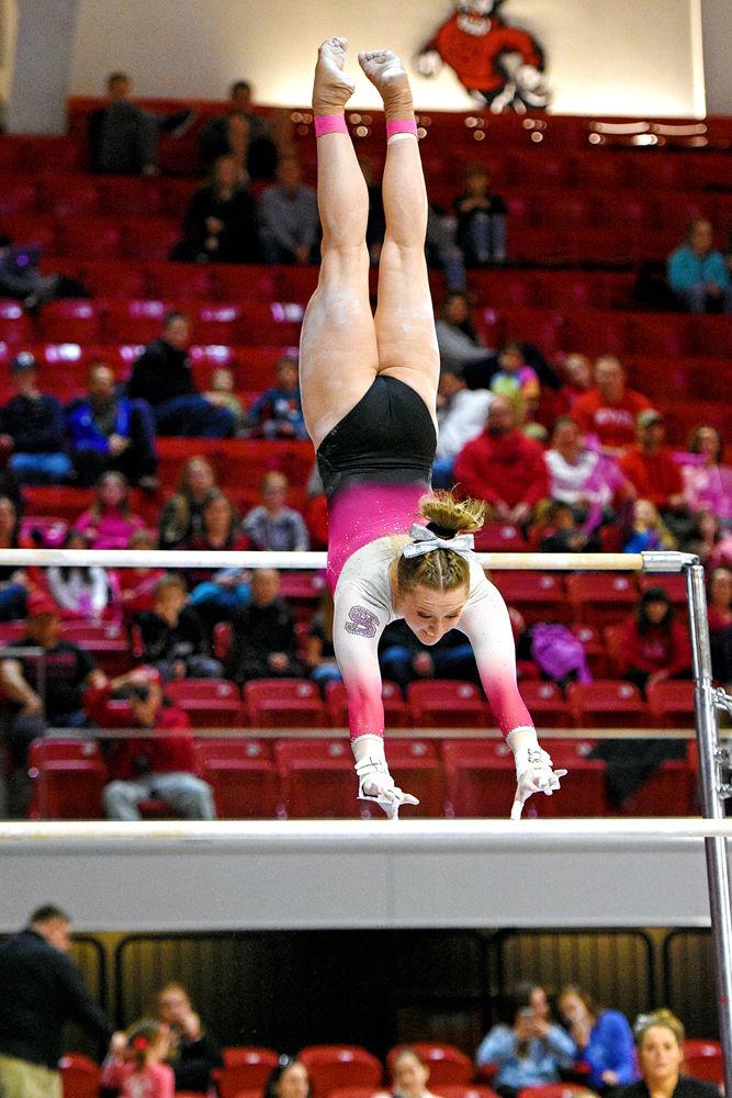Freshman Meredith Robinson performs on the uneven bars during the gymnastics match against Pittsburgh at Reynolds Coliseum on Saturday, Feb. 9, 2019. The Wolfpack beat Pittsburgh 196.400 - 194.825 bringing their win record to 5-2. Robinson had an Uneven Bars score of 9.8.