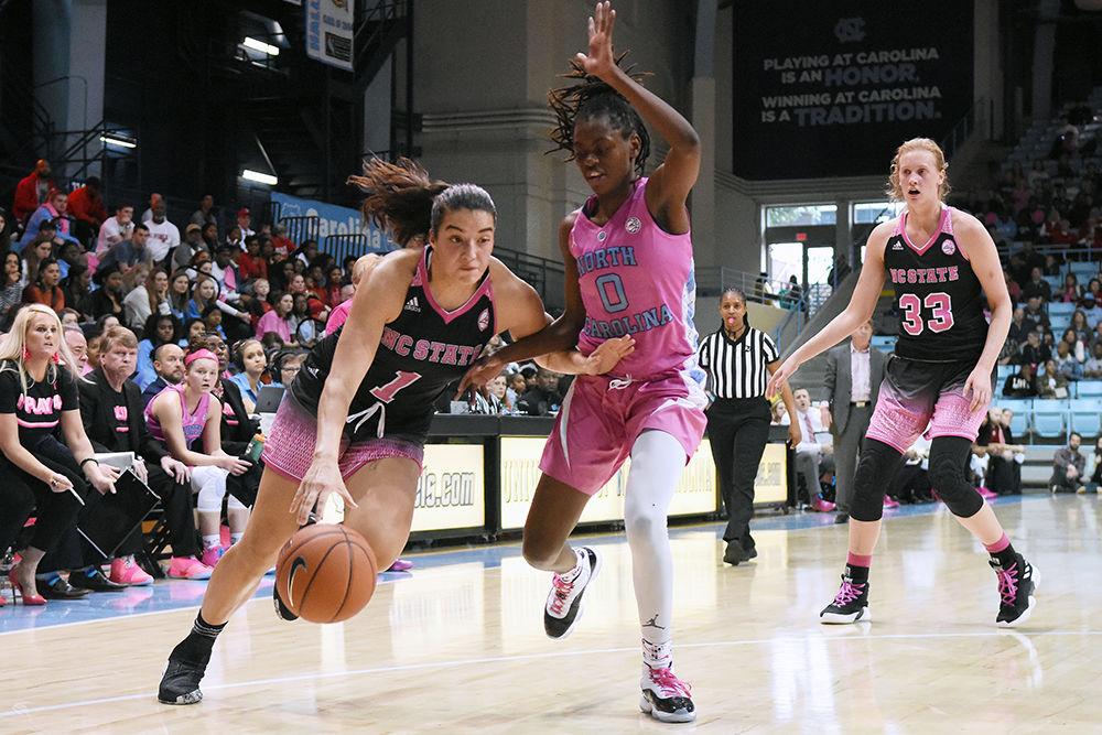 Junior guard Aislinn Konig pushes past a UNC-Chapel Hill defender during the game on Sunday, Feb. 24, 2019 in Carmichael Arena. The Wolfpack beat the Tarheels 74-69.