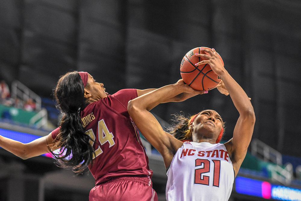 Senior foward DD Rodgers dodges the Seminoles defense and goes up for a layup during the ACC Women's Basketball Tournament on Friday, March 8, 2019 in the Greensboro Coliseum. Rodgers scored 16 points and had 10 assists against Florida State. The Wolfpack recieved a double bye in the tournament and had their first match-up against the Seminoles. The Wolfpack beat Florida State 69-62 to advance to the semi-finals.