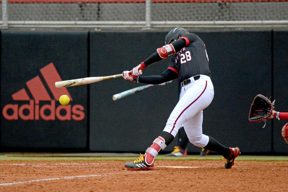 Junior utility player Brigette Nordberg hits a foul ball against Wisconsin on Sunday, Feb. 17, 2019 at Dail Softball Stadium. Nordberg went 1-3 with one home run and two runs batted in in the Wolfpack&#8217;s 6-3 loss.